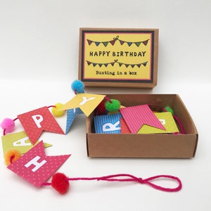 Happy Birthday mini paper bunting with pom poms in a matchbox