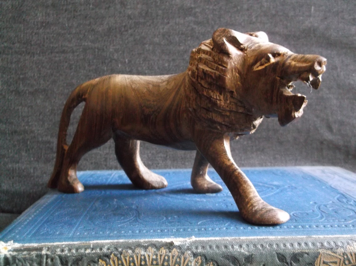 Carved wooden lion figurine Etsy