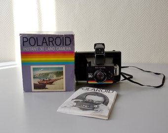 Vintage Polaroid INSTANT 30 in its original box with user manual.