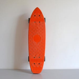 Vintage orange skateboard, 70s cruiser skateboard