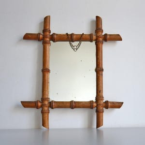 Vintage mirror in turned bamboo wood, bohemian decoration from the 60s