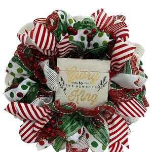 Christmas Carol wreath with red and green ribbons for front door