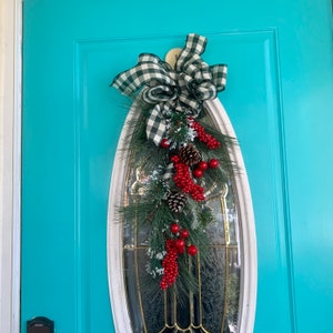 Christmas swag, black and white Buffalo check bow, holly berries evergreen swag