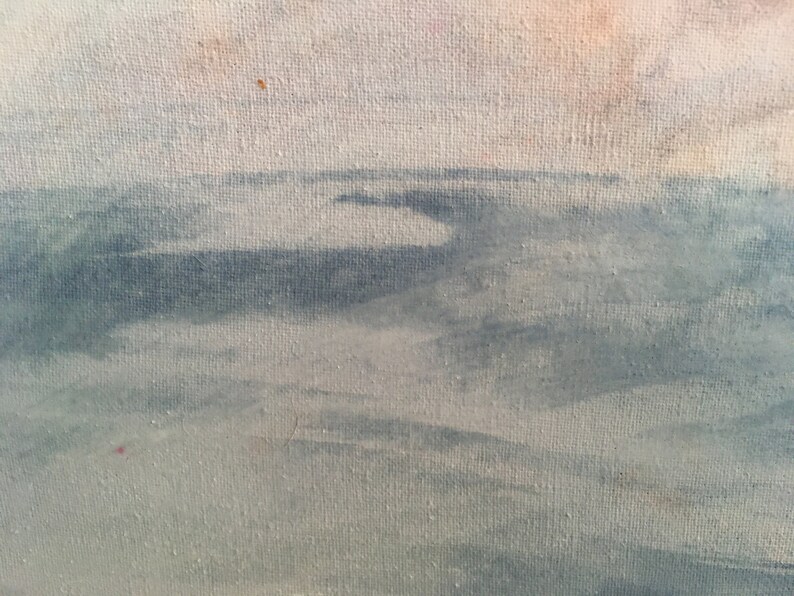 May include: A close-up of a canvas painting depicting a seascape with a light blue sky and a dark blue ocean. The ocean is painted with brushstrokes that create a sense of movement.