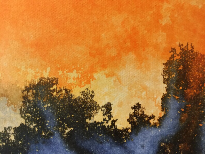 May include: Watercolor painting of a sunset with orange, yellow, and blue hues. The sky is filled with clouds and the silhouette of trees is visible in the foreground.