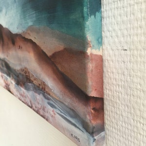 May include: Abstract painting on canvas with a blue, green, and brown color scheme. The painting features a figure lying down with a textured background. The artist's signature, "M.ORS", is visible in the lower right corner.