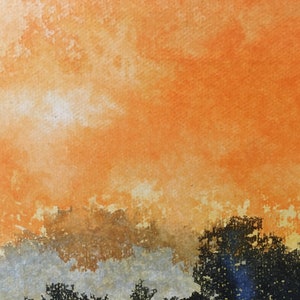May include: A watercolor painting of a sunset with orange, yellow, and brown hues. The sky is a vibrant orange, with clouds that are a lighter shade of orange and yellow. The bottom of the painting is a darker brown, with hints of gray.