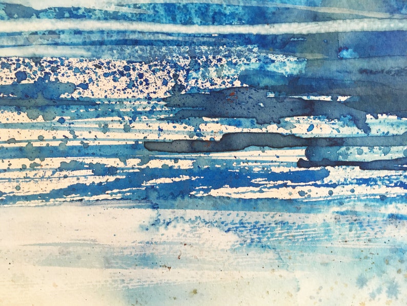 May include: Abstract watercolor painting with blue and white stripes and splatters of blue paint.