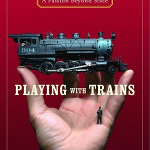 May include: A book cover with a red background and a small toy train on a hand. The title of the book is "Playing with Trains" and the author is "Sam Posey". The book cover also includes the text "A Passion Beyond Scale" and a quote from the Chicago Sun-Times.