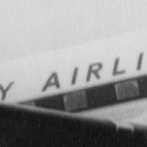 May include: Black and white image of an airplane's fuselage. The text "SEY AIRLINES" is visible in a sans-serif font. The image is slightly angled, showing a portion of the plane's wing or body.