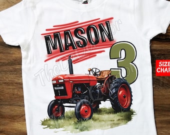 May include: White t-shirt with a red tractor, green number 3, and the name "MASON" in black lettering with red stripes.