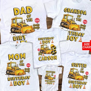 May include: White t-shirts featuring construction vehicle graphics. The shirts display a yellow bulldozer and text such as "DAD OF THE BIRTHDAY BOY", "MOM OF THE BIRTHDAY BOY", "GRANDPA OF THE BIRTHDAY BOY", "SISTER OF THE BIRTHDAY BOY", and "BROTHER OF THE BIRTHDAY BOY".