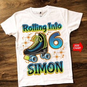 May include: White t-shirt with a colorful graphic of roller skates, the number 6, and the name "Simon". The text "Rolling Into" is above the graphic. The graphic has a blue, green, and orange color scheme.