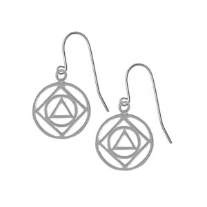 May include: Silver dangle earrings with a geometric design featuring a circle, square, and triangle.