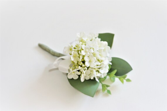Image of Hydrangea corsage with white flowers and greenery