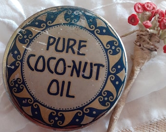 May include: A vintage tin container with a gold and blue design. The lid features the text "PURE COCO-NUT OIL" in a decorative font.