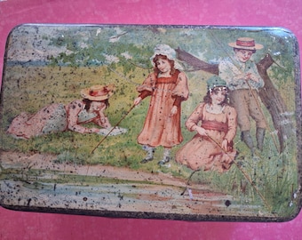 May include: A rectangular metal tin featuring a vintage illustration of four children fishing by a stream. The scene depicts one child lying on the grass, two standing, and one sitting, all wearing period clothing and hats, with a weathered finish.