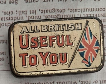 May include: A rectangular metal tin with a distressed cream finish, featuring the text ALL BRITISH USEFUL TO YOU in black and red lettering, accompanied by an illustration of a Union Jack flag on a pole, showing signs of vintage wear.
