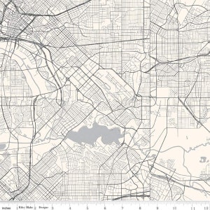 May include: A detailed map of a city, featuring a network of roads, highways, and waterways in a grayscale color scheme. The map covers an area approximately 12 inches wide. The text "Riley Blake Designs" is visible at the bottom.