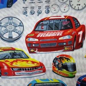 May include: A fabric pattern featuring race cars, wheels, and racing helmets. The cars are red, yellow, and blue, with text like "OVERDRIVE" and "ZOOM". The background is a checkered pattern with gauges and racing-related graphics.