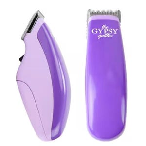 May include: Two cordless quilting clippers. One clipper is lavender and light purple. The other clipper is purple with the text "the GYPSY quilter" in white.
