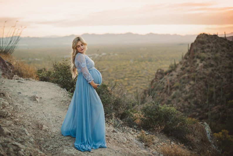 Karina is the boho lace maternity dress of your dreams. With a sheer bust and chiffon skirt, this maternity gown is a beautiful option for your maternity shoot or special event. Crochet lace and long sleeves add interest to the gorgeous look.