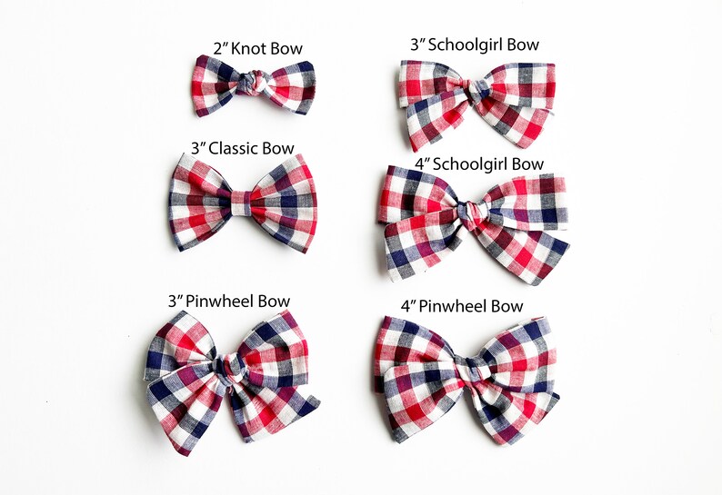 May include: Six red, white and blue gingham hair bows in various sizes and styles. The bows are labelled with their size and style: 2" Knot Bow, 3" Schoolgirl Bow, 3" Classic Bow, 4" Schoolgirl Bow, 3" Pinwheel Bow, and 4" Pinwheel Bow.