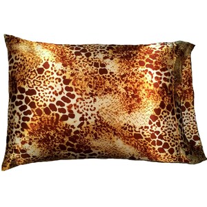 May include: A brown and tan satin pillowcase with a leopard print pattern.