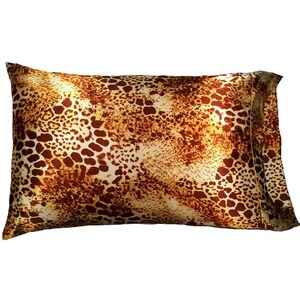May include: A brown and white leopard print satin pillowcase.