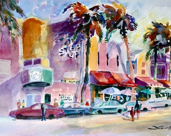 May include: A watercolor painting of a street scene with palm trees, buildings, and cars. The buildings have colorful facades and awnings. The text "The Surf" is visible on one of the buildings.
