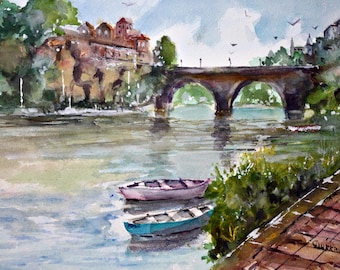 May include: Watercolor painting of a river scene with a stone bridge and buildings on the bank. Two small boats float in the water. The sky is blue with a few clouds and birds.