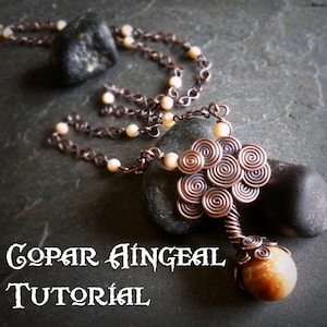May include: A copper wire tree pendant necklace with a brown stone at the base. The necklace is made with copper chain and white beads. The pendant is a tree with a copper wire trunk and branches with copper wire leaves. The pendant is hanging from a copper chain with white beads.