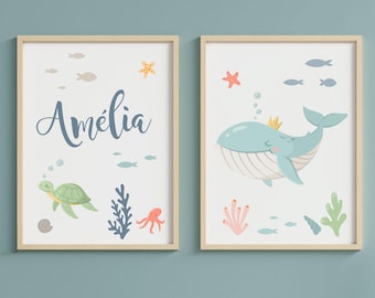 May include: Two framed prints with a nautical theme. The left print features a sea turtle, seaweed, an octopus, and the name Amelia. The right print features a blue whale with a crown, coral, and starfish.