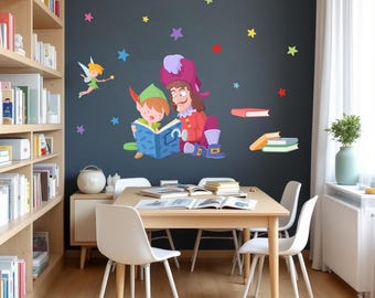 May include: A cartoon illustration of Peter Pan and Captain Hook reading a book together. The illustration is on a dark grey wall with colorful stars. There is a wooden bookshelf and a table with chairs in the background.