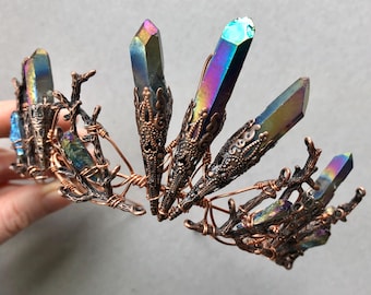 May include: A copper wire crown with iridescent crystal points and branches. The crown is made with wire wrapped around the crystals and branches.