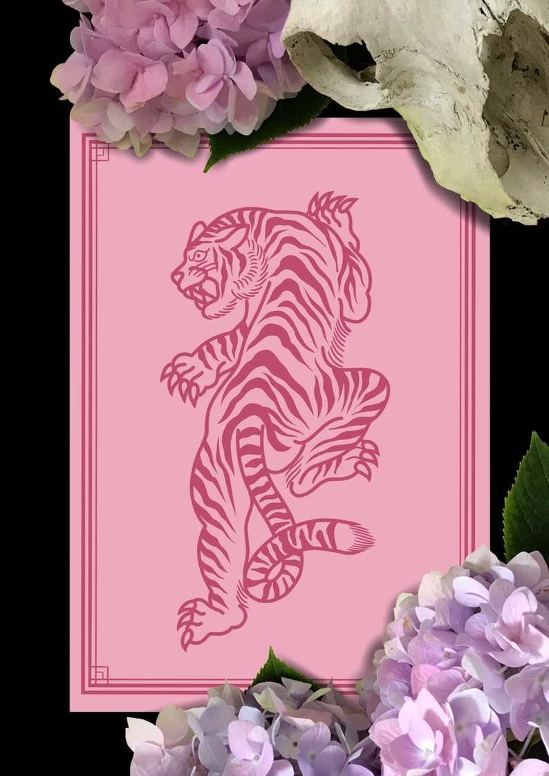 May include: A pink and white print of a stylized tiger on a pink background with a decorative border. The tiger is facing left and has a curled tail.