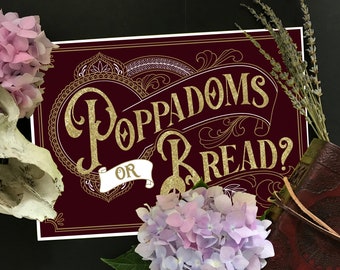 May include: A burgundy sign with gold lettering that reads "Poppadoms or Bread?" with ornate gold designs around the text. The sign is surrounded by flowers and a book.