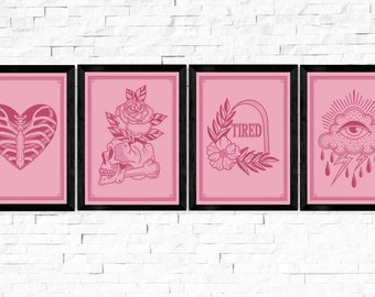 May include: Four framed pink art prints with black frames. The prints feature gothic-inspired illustrations: a heart-shaped ribcage, a skull with a rose, the word "TIRED", and an eye in a cloud with lightning.