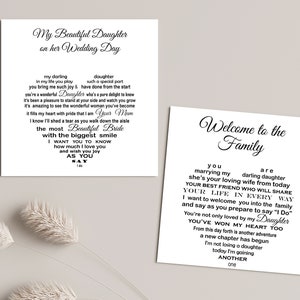 May include: Two white cards with black calligraphy text. One card reads "My Beautiful Daughter on her Wedding Day" with a heart-shaped poem. The other card says "Welcome to the Family" with a heart-shaped poem.