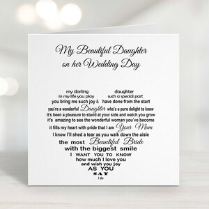 May include: A white wedding card with black script. The text reads "My Beautiful Daughter on her Wedding Day." Inside, a heart-shaped arrangement of text includes phrases like "Beautiful Bride" and "I do." The card is a sentimental gift.