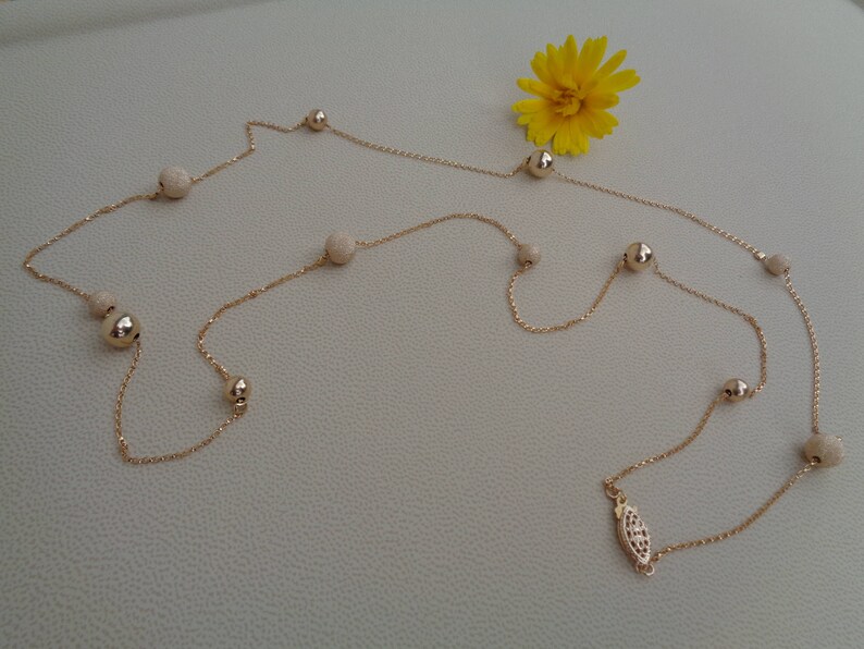 Long gold chain smooth and stardust with moving balls 585 gold filled