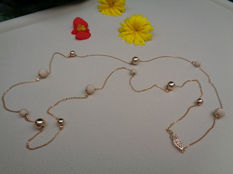 Long gold chain smooth and stardust with moving balls 585 gold filled