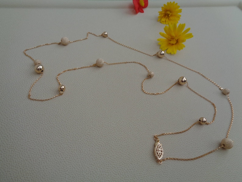 Long gold chain smooth and stardust with moving balls 585 gold filled
