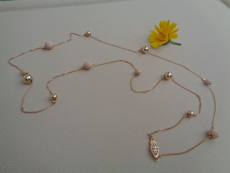 Long gold chain smooth and stardust with moving balls 585 gold filled