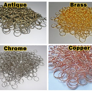 May include: A pile of small, round, metal key rings in four different finishes: antique, brass, chrome, and copper.