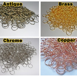 May include: A large pile of small, round, metal key rings in four different finishes: antique, brass, chrome, and copper.