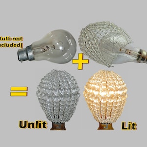 May include: A clear glass light bulb with a decorative crystal bead cover. The image shows the cover unlit and lit, with the light bulb glowing yellow. The text "Bulb not included" is written in red on a yellow background.