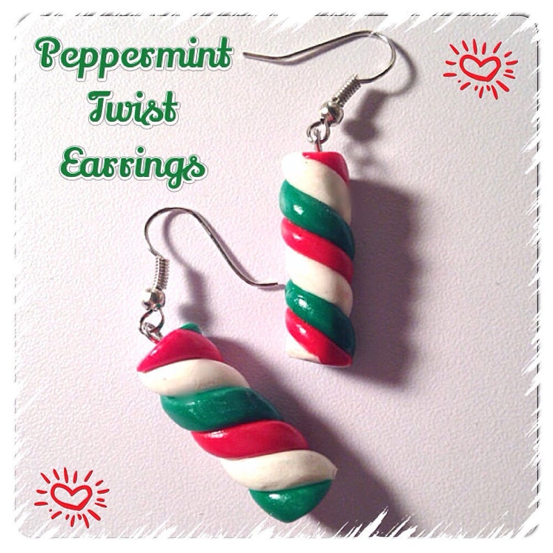 May include: Peppermint Twist Earrings, a pair of silver dangle earrings with red, white, and green candy cane-shaped charms.
