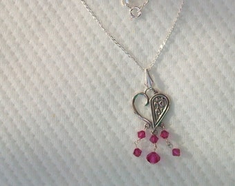 Sterling silver and swarovski crystal pendant.