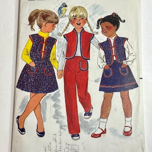 May include: A Butterick 3367 sewing pattern envelope for size medium. The illustration features three figures wearing vests, skirts, and pants in red, blue, and yellow. The cover includes the brand name, pattern number 3367, and price $1.75.
